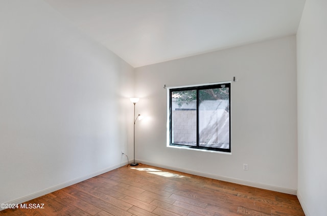 spare room featuring light wood-type flooring