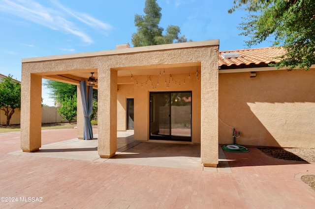 entrance to property with a patio area