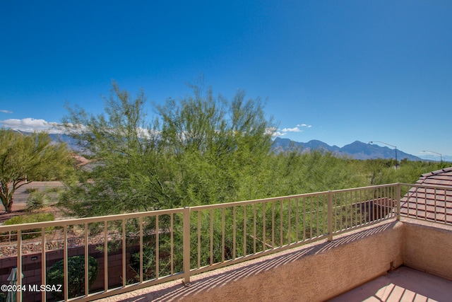 balcony featuring a mountain view