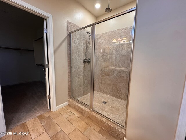 bathroom featuring an enclosed shower and vanity