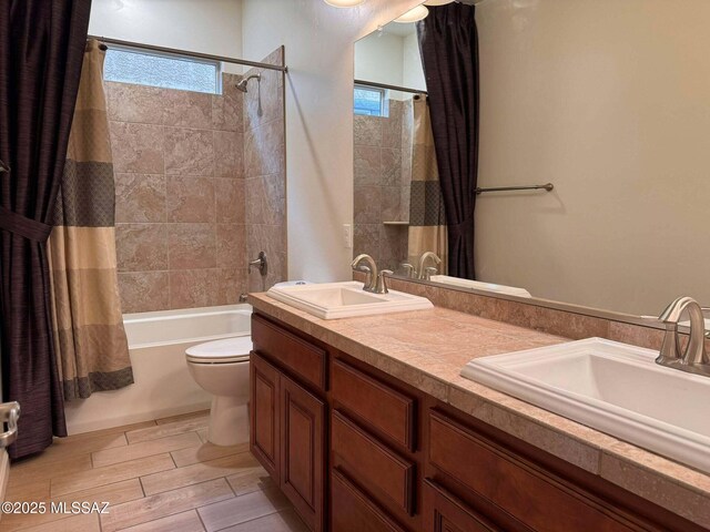 carpeted bedroom with a closet, a walk in closet, and ceiling fan