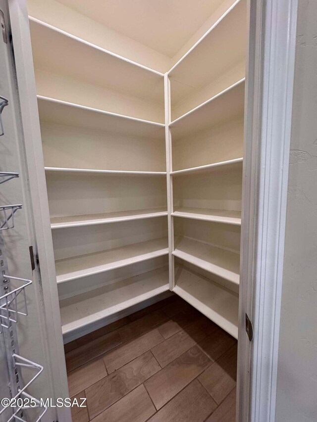 carpeted bedroom featuring ceiling fan and a closet