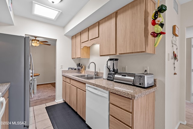 kitchen with stainless steel fridge, dishwasher, sink, light brown cabinets, and ceiling fan