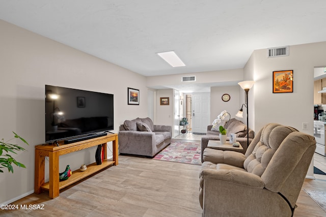 living room with light hardwood / wood-style flooring