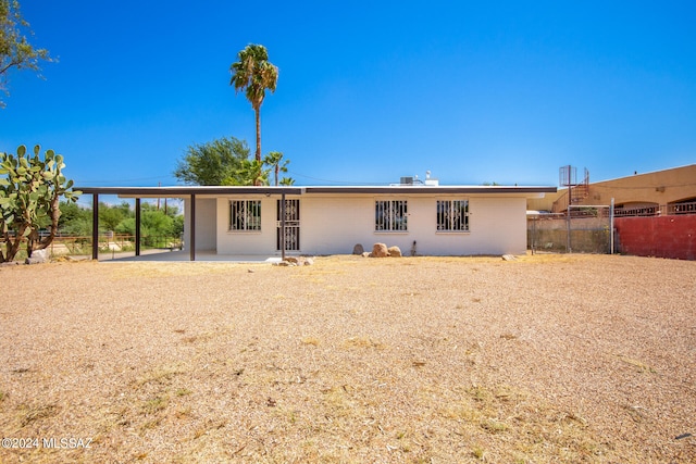 back of property featuring a patio area