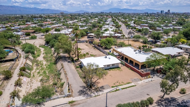 birds eye view of property featuring a mountain view