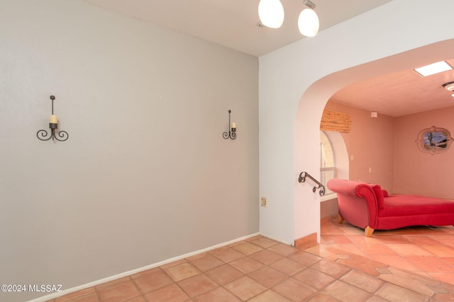 empty room featuring light tile patterned floors