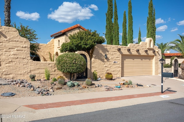 view of front of property with a garage