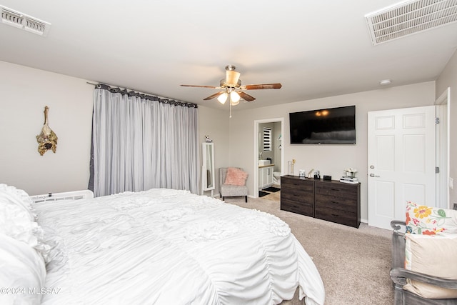 carpeted bedroom with visible vents and a ceiling fan