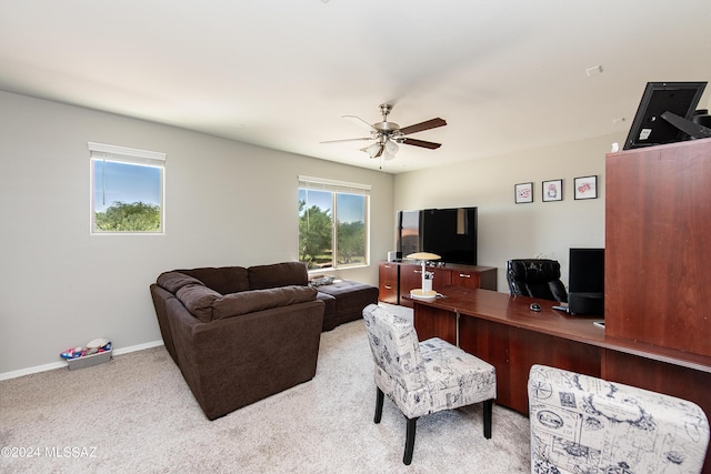 office with carpet floors, ceiling fan, and baseboards