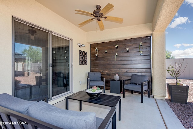 view of patio featuring a ceiling fan and fence