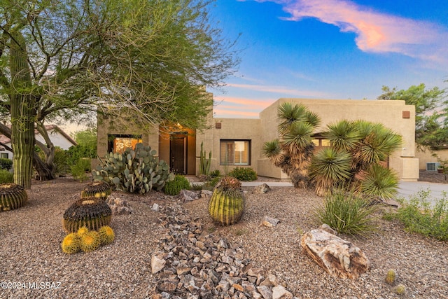 southwest-style home featuring stucco siding