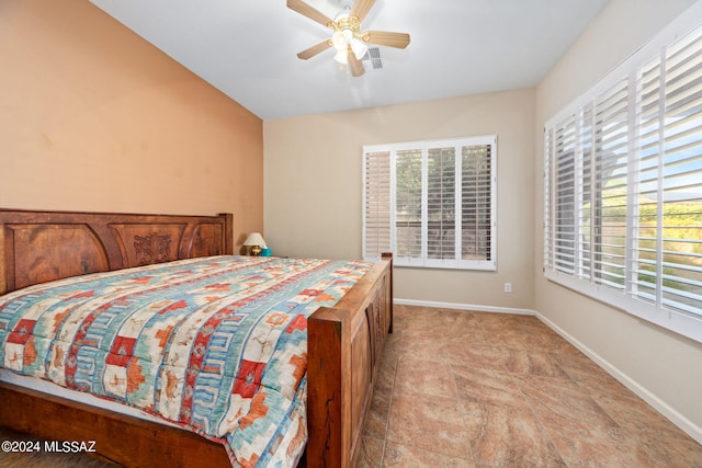 bedroom with visible vents, baseboards, and a ceiling fan