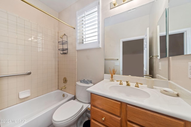 bathroom with vanity, shower / tub combination, toilet, and visible vents