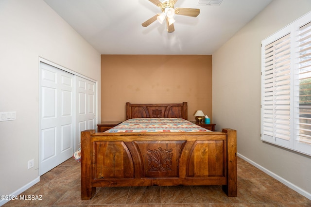 bedroom with visible vents, a ceiling fan, baseboards, and a closet