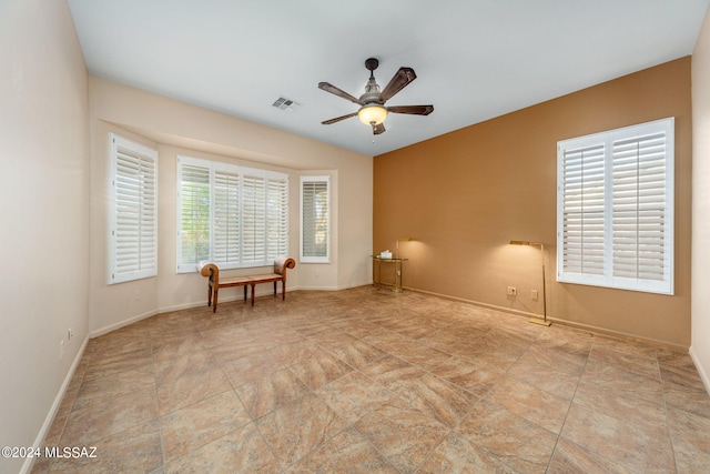 unfurnished room featuring visible vents, baseboards, and ceiling fan