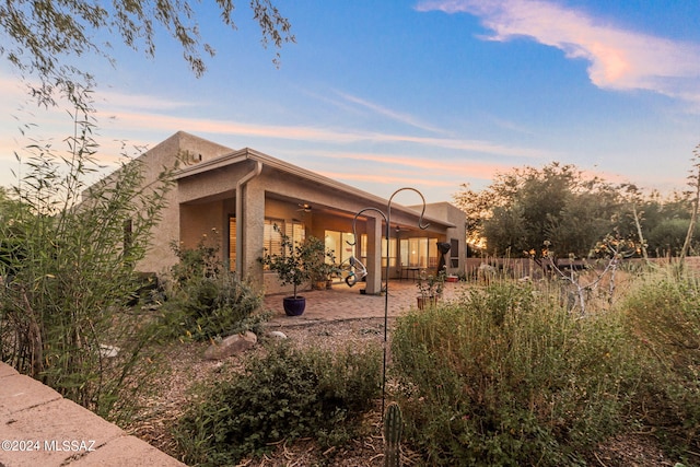 exterior space with a patio and a ceiling fan