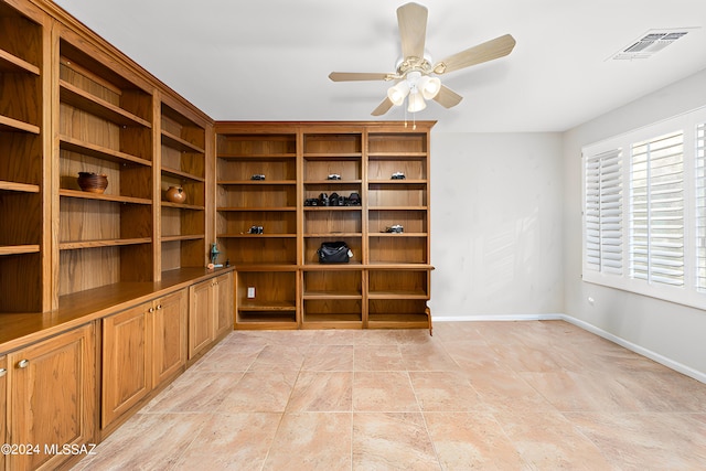 unfurnished room with ceiling fan