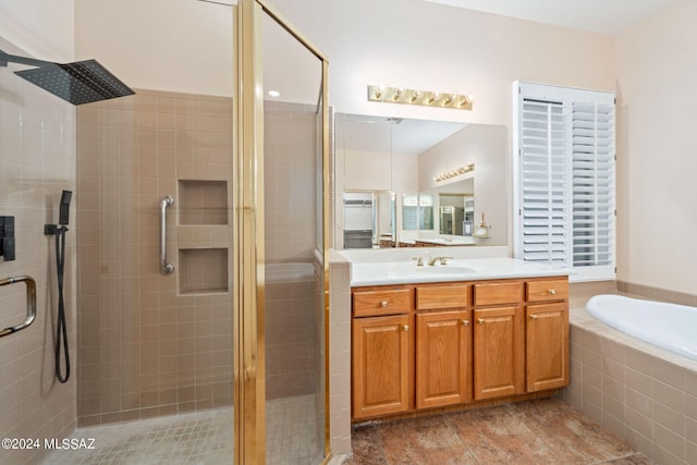 bathroom with a bath, a shower stall, tile patterned floors, and vanity