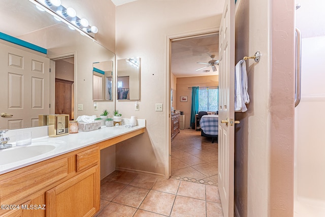 bathroom with tile patterned floors, ceiling fan, and vanity