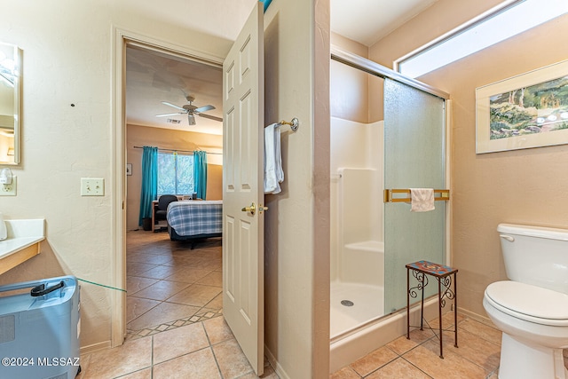 bathroom with ceiling fan, an enclosed shower, tile patterned floors, and toilet