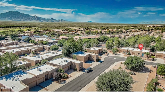 birds eye view of property featuring a mountain view