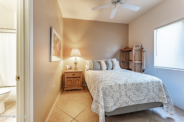 bedroom featuring light tile patterned floors and ceiling fan