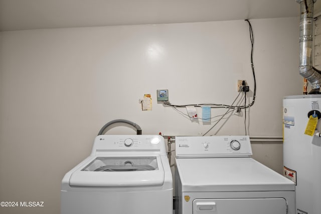 laundry area featuring washer and dryer and water heater