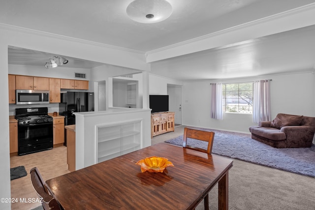 carpeted dining space with crown molding