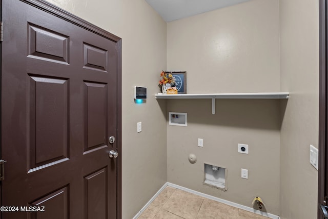 clothes washing area with washer hookup, hookup for a gas dryer, light tile patterned flooring, and electric dryer hookup