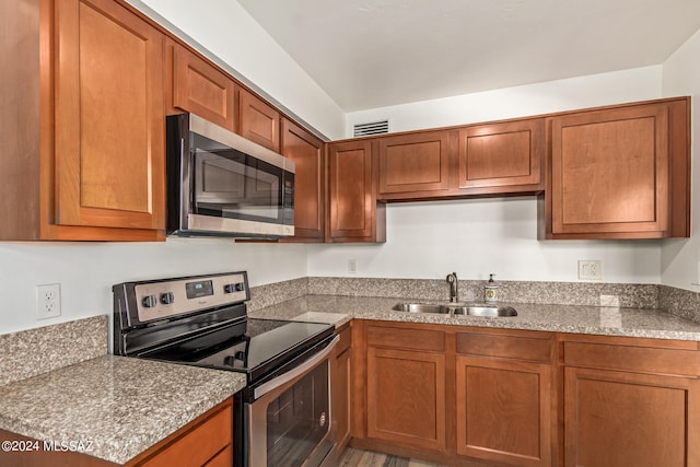 kitchen with appliances with stainless steel finishes and sink