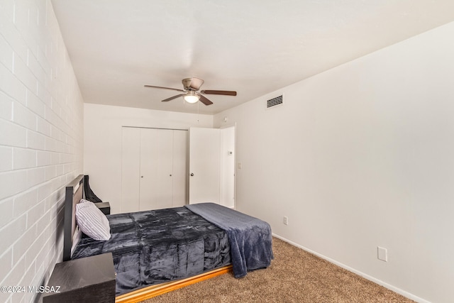 bedroom with carpet flooring, a closet, and ceiling fan