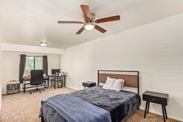 bedroom featuring light carpet, brick wall, and ceiling fan