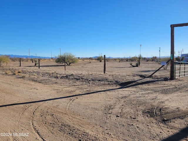 view of yard with a rural view