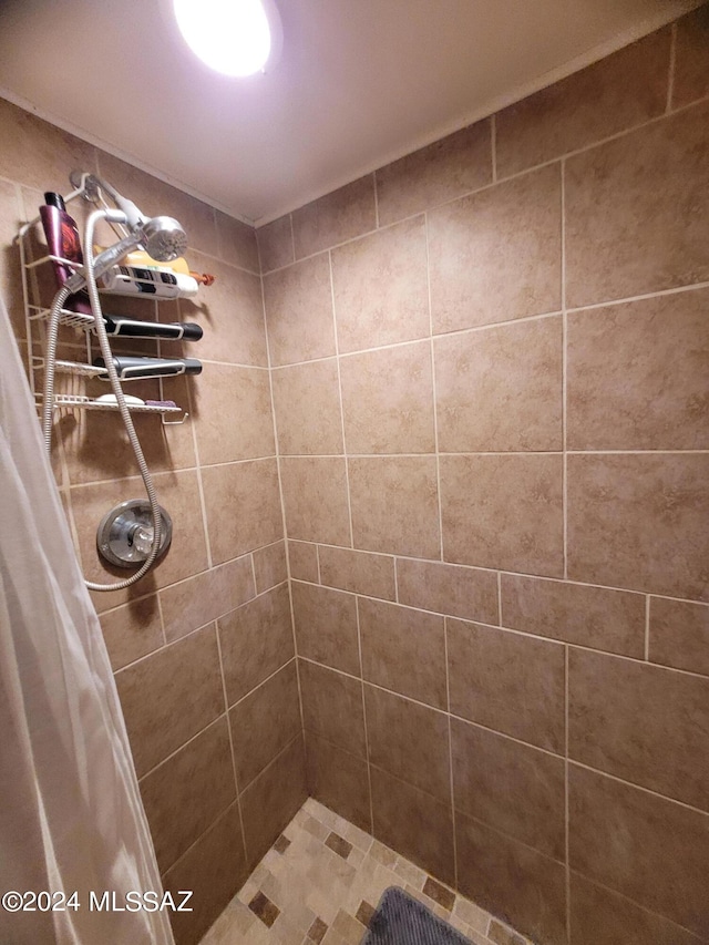 bathroom featuring curtained shower