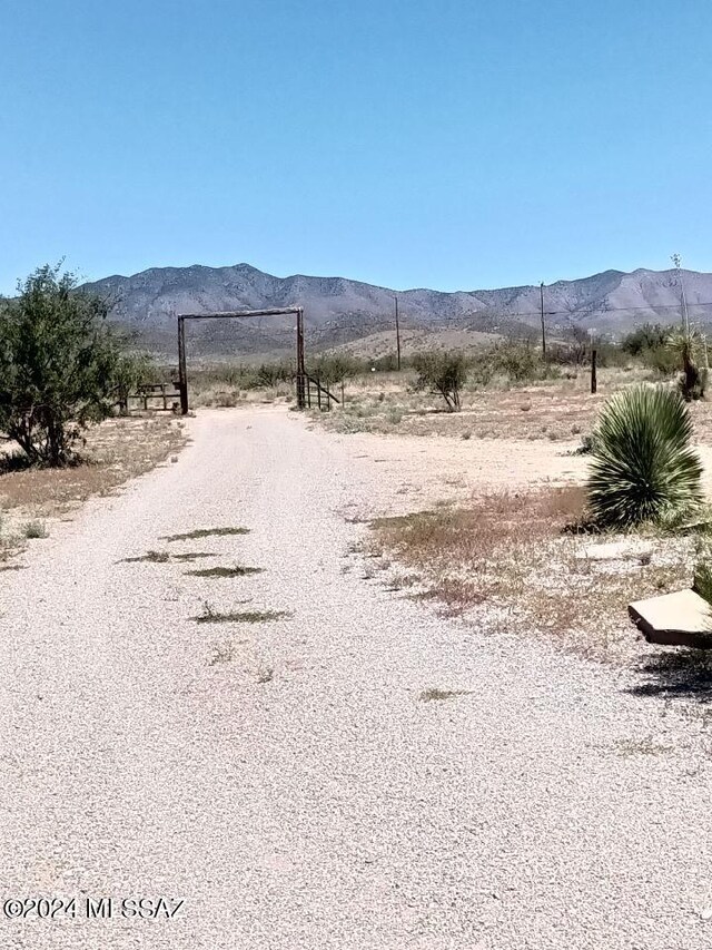 view of street featuring a rural view and a mountain view