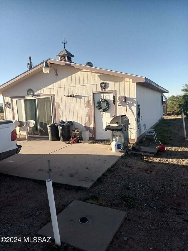 back of property featuring a patio