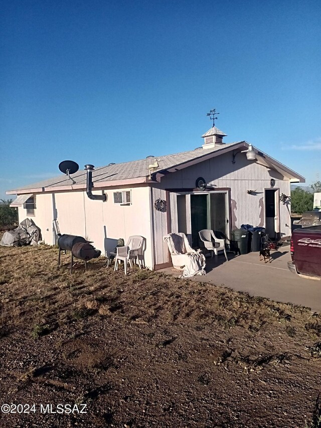 back of property with a patio area