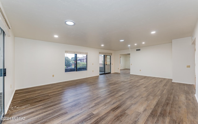 unfurnished living room with hardwood / wood-style flooring