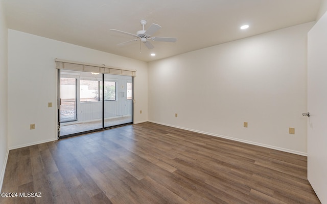 unfurnished room featuring dark hardwood / wood-style floors and ceiling fan