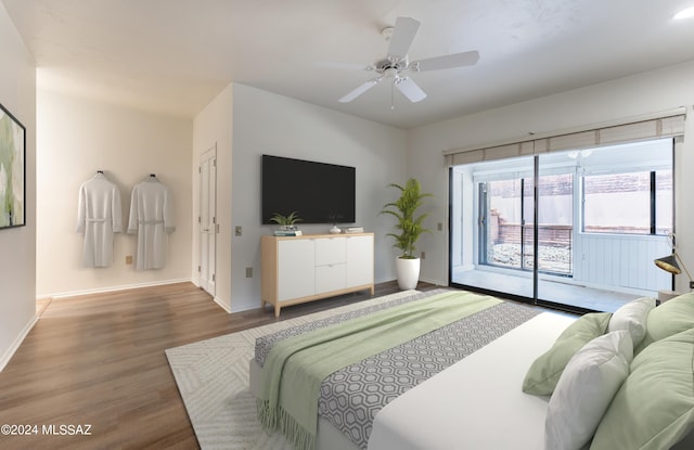 bedroom with ceiling fan, hardwood / wood-style floors, and access to exterior