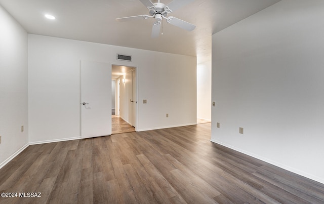 unfurnished room featuring dark hardwood / wood-style floors and ceiling fan