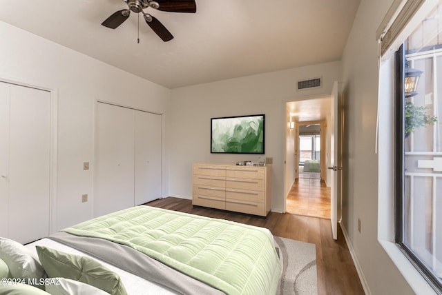 bedroom featuring dark hardwood / wood-style flooring and ceiling fan