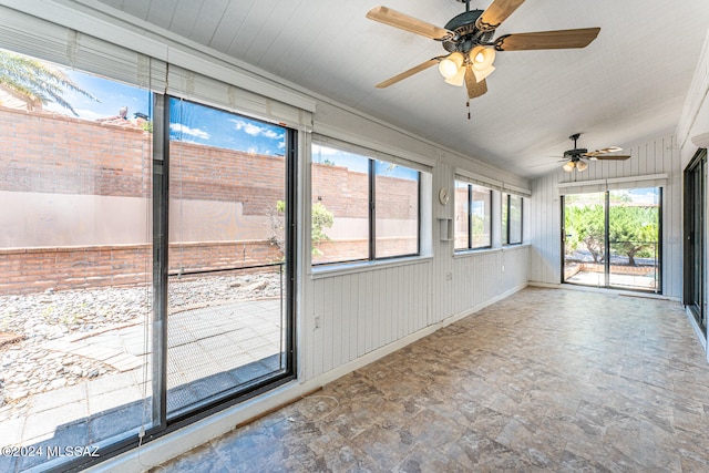 unfurnished sunroom featuring vaulted ceiling and ceiling fan