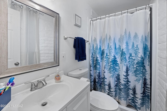 bathroom with vanity, toilet, and a shower with curtain