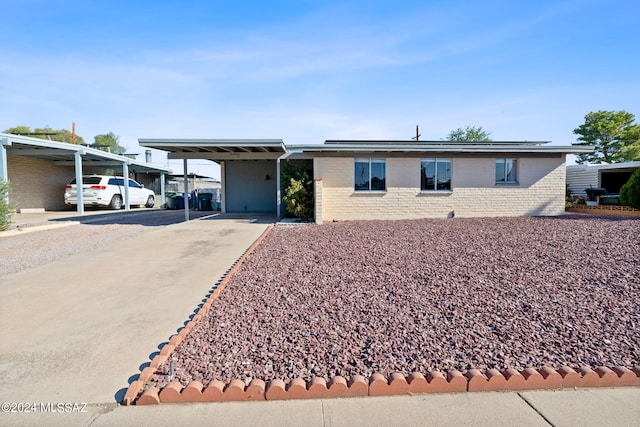 ranch-style house with a carport