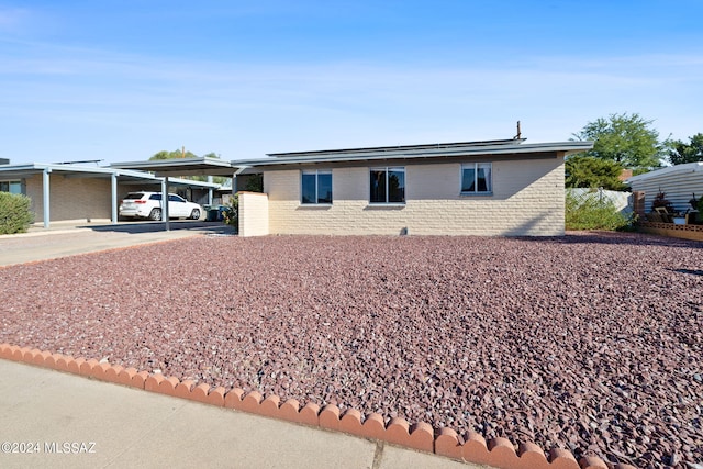 ranch-style house with a carport