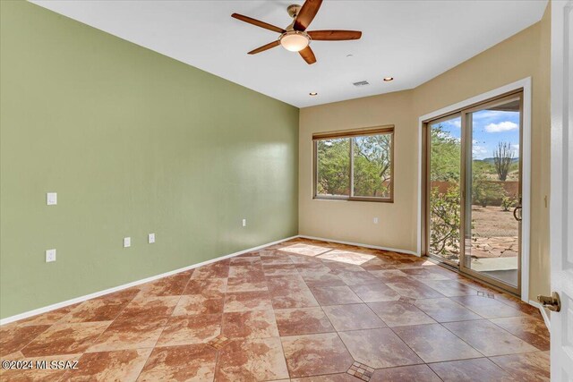 empty room featuring ceiling fan