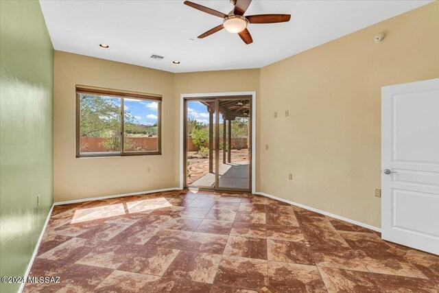 unfurnished room featuring ceiling fan