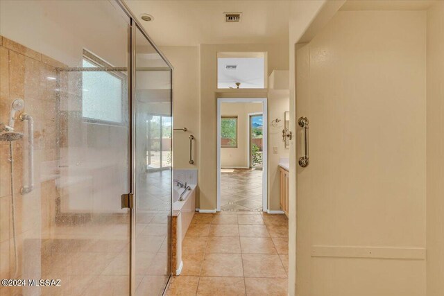 bathroom with shower with separate bathtub, tile patterned floors, and vanity